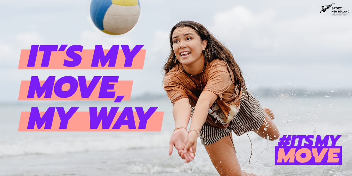 Girl playing volleyball in the ocean