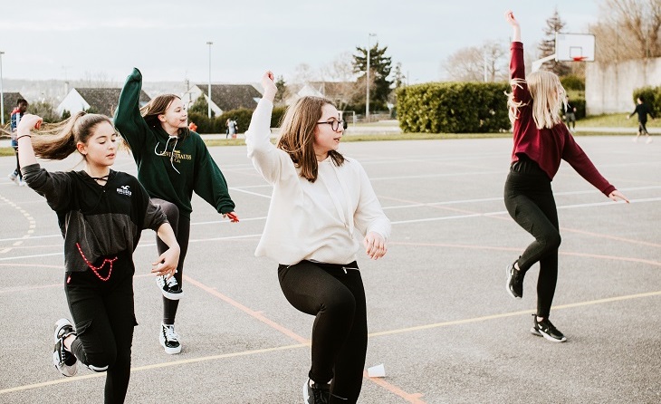 Young women dancing on a court