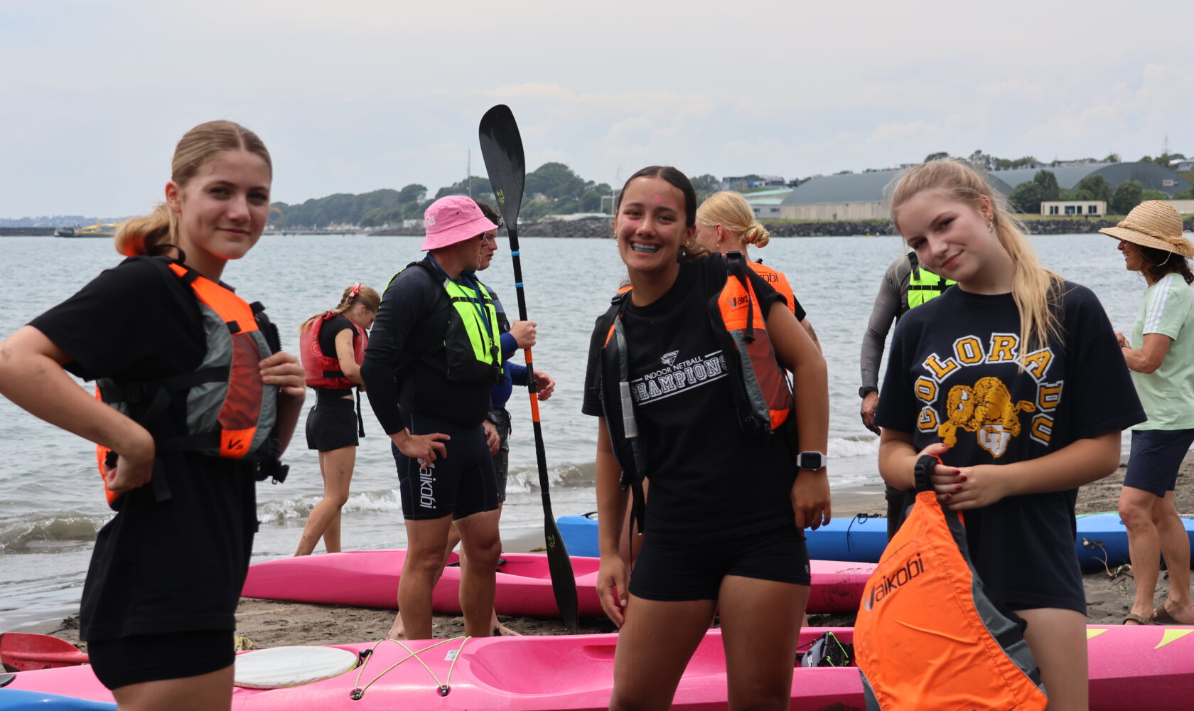 Young women getting ready to paddle on a kayak